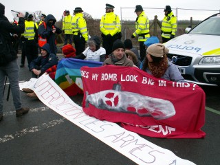 French peace campaigners block road into Burghfield